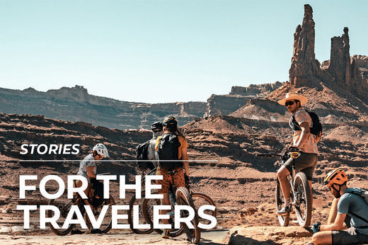 people on bicycles in desert area